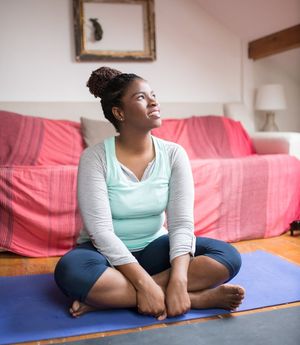 A person sitting quietly in a cross-legged position.